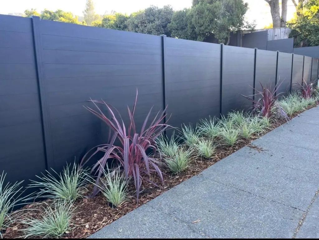 Fence Contractor in Los Altos Hills installing modern privacy fencing on a luxury hillside property