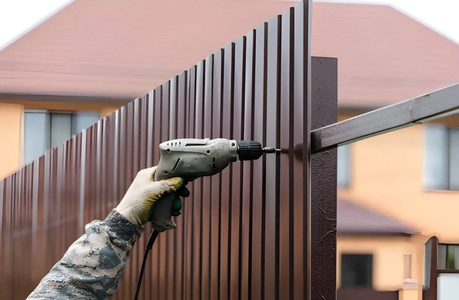 Fence Builders installing modern automated fence system for secure property access